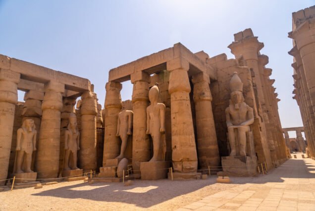 Sculptures of pharaohs and ancient Egyptian drawings on the columns of the Luxor Temple